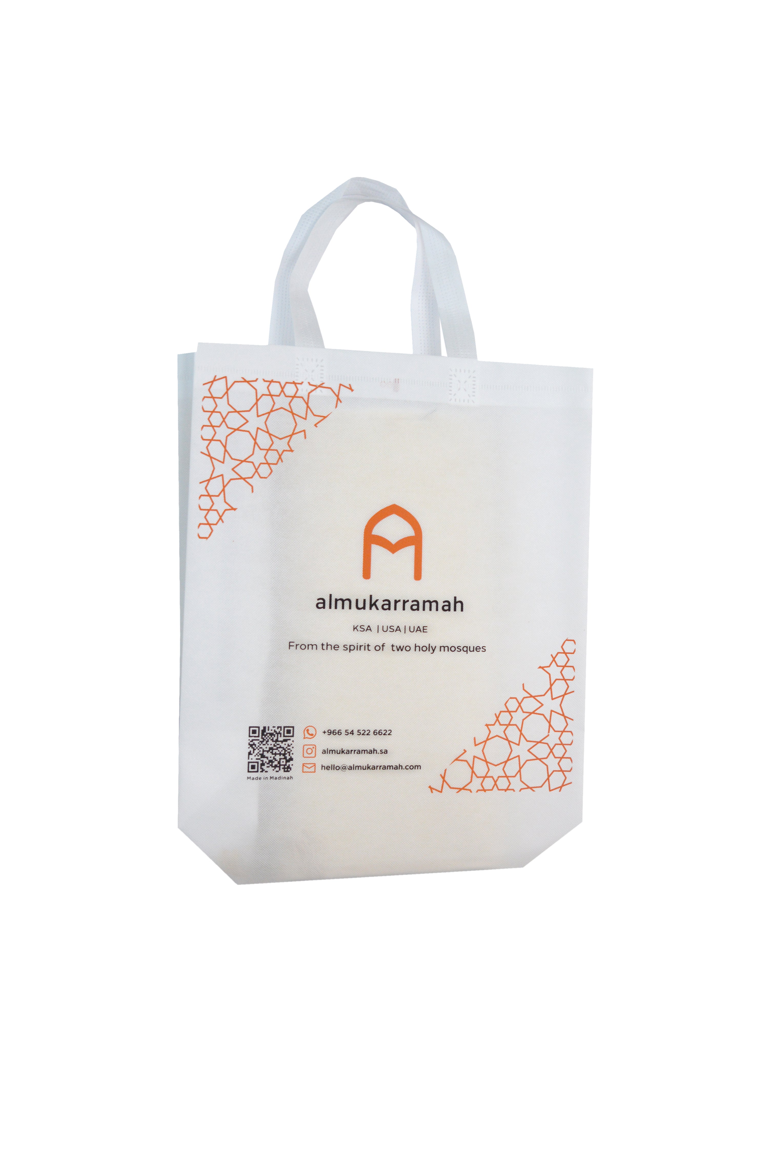 Almukarramah white gift bag featuring elegant brown designs, showcasing a sophisticated and stylish appearance.