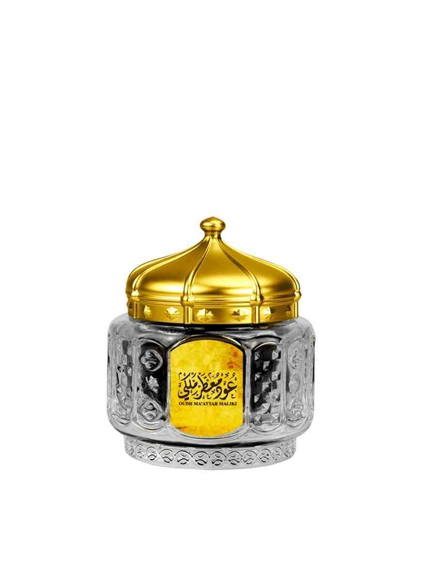 Bottle of Oud Ma'attar Maliki with an ornate design, featuring rich gold accents.