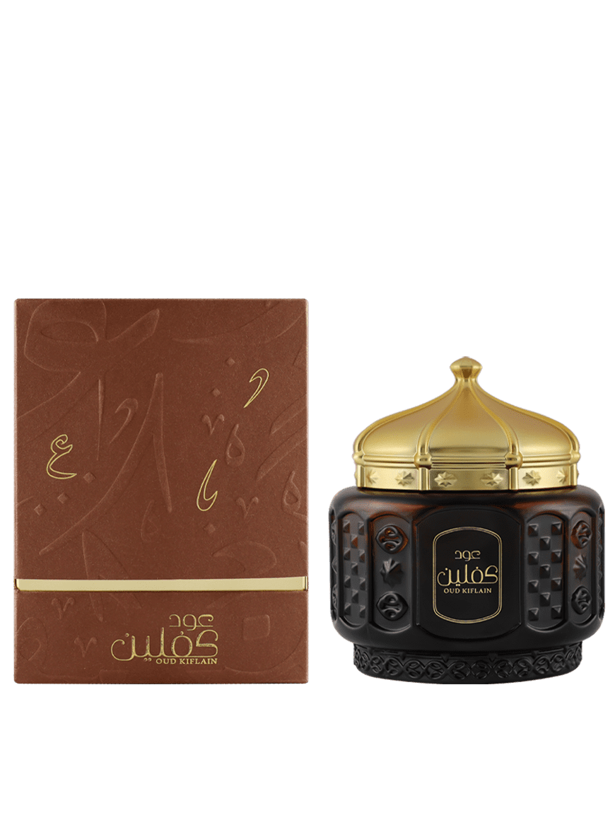 Oud Kifain perfume bottle with gold detailing, presented in a luxurious brown box. | www.almukarramah.com